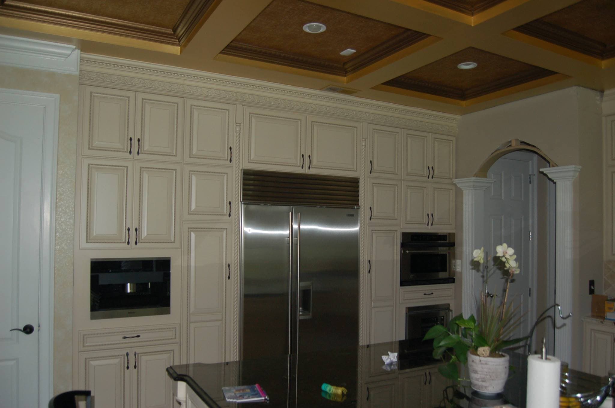 Traditional cream kitchen with raised panel cabinet doors