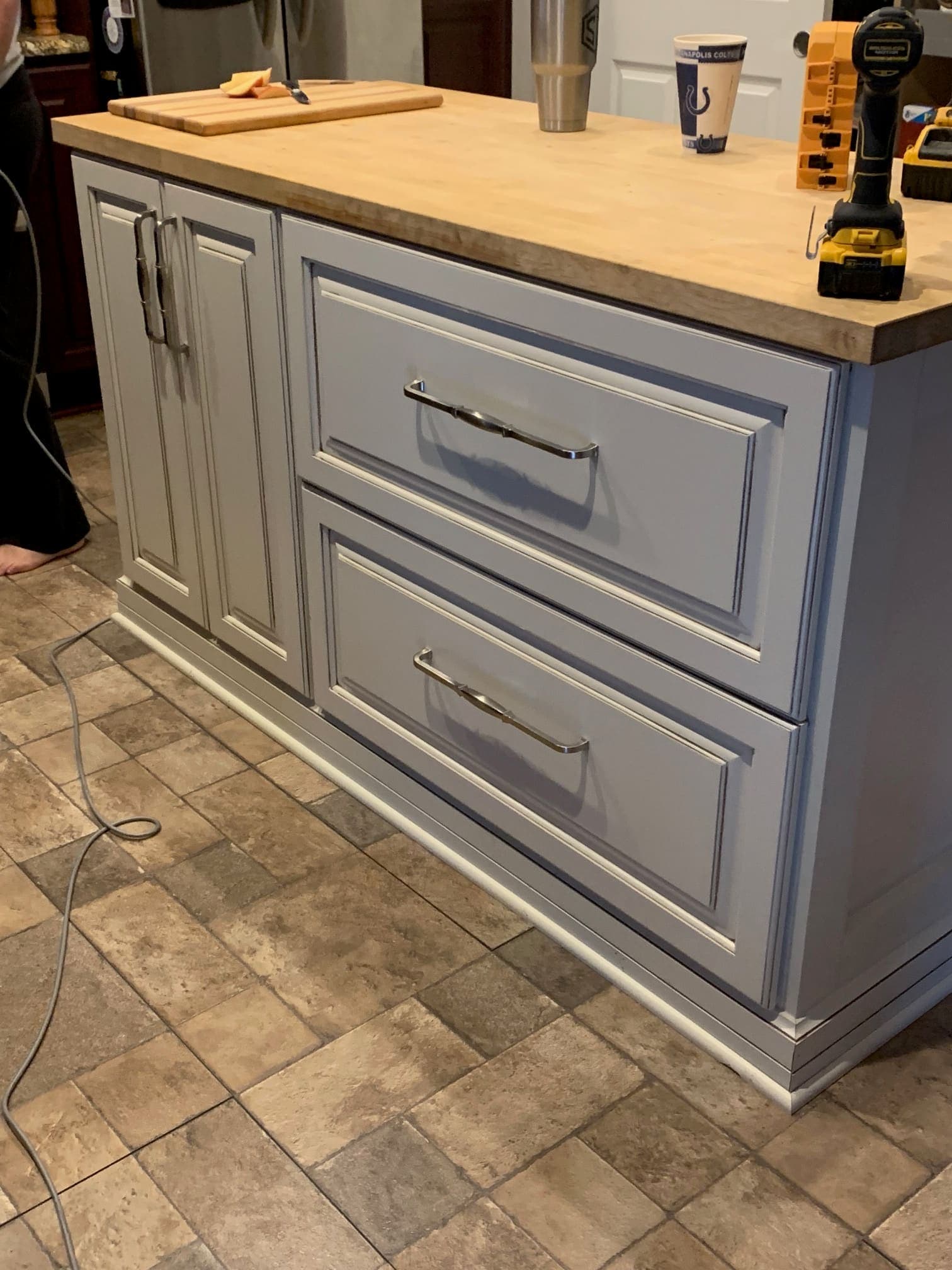 Gray raised panel kitchen with stone countertops