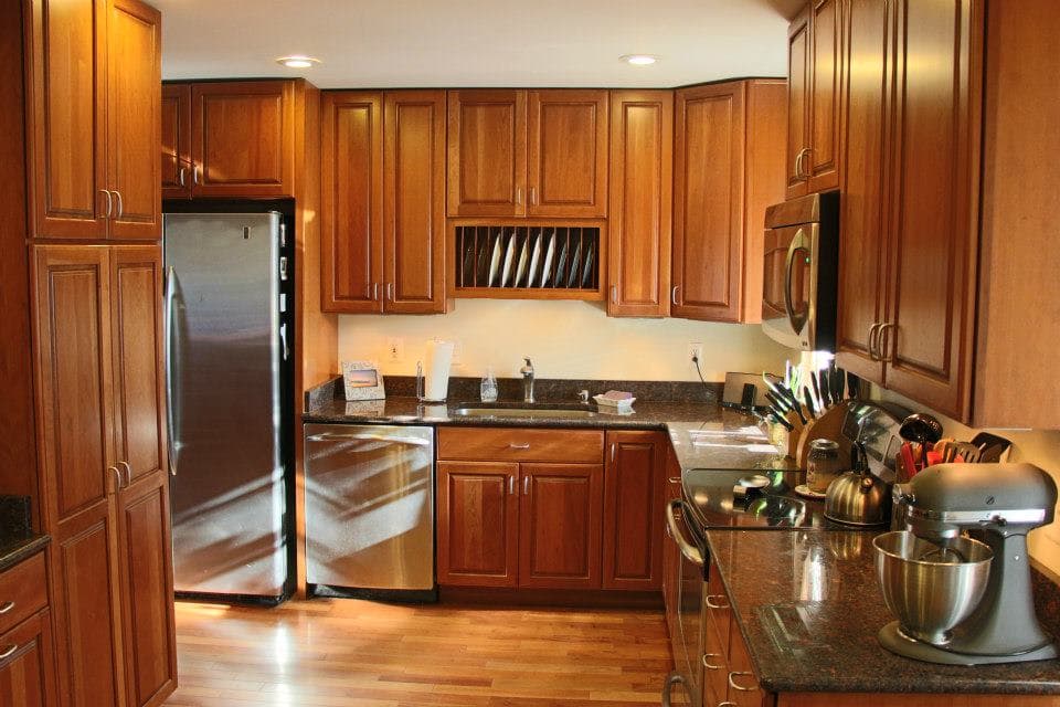 Traditional cherry wood kitchen with granite countertops
